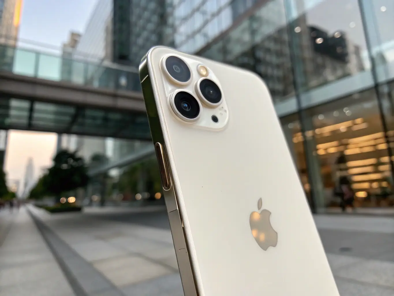 A close-up shot of a refurbished iPhone 13 Pro in excellent condition, showcasing its sleek design and vibrant display. The background is blurred to emphasize the phone's premium appearance.