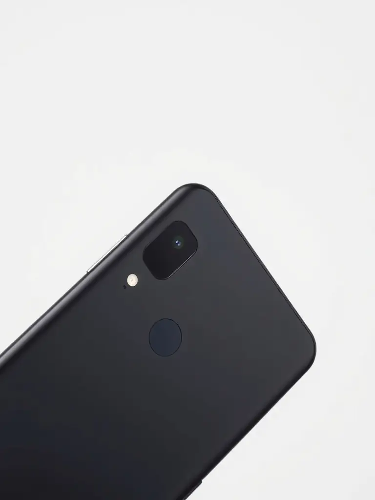 A close-up studio shot of a refurbished Google Pixel 7, highlighting its sleek design and camera lens, placed on a clean white surface.